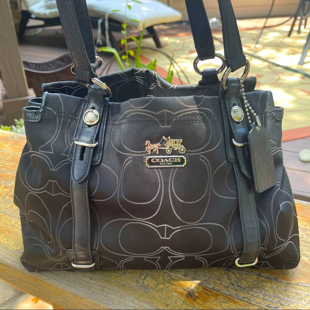 Gently used Coach purse black purple interior